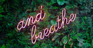 and breathe neon sign on tre